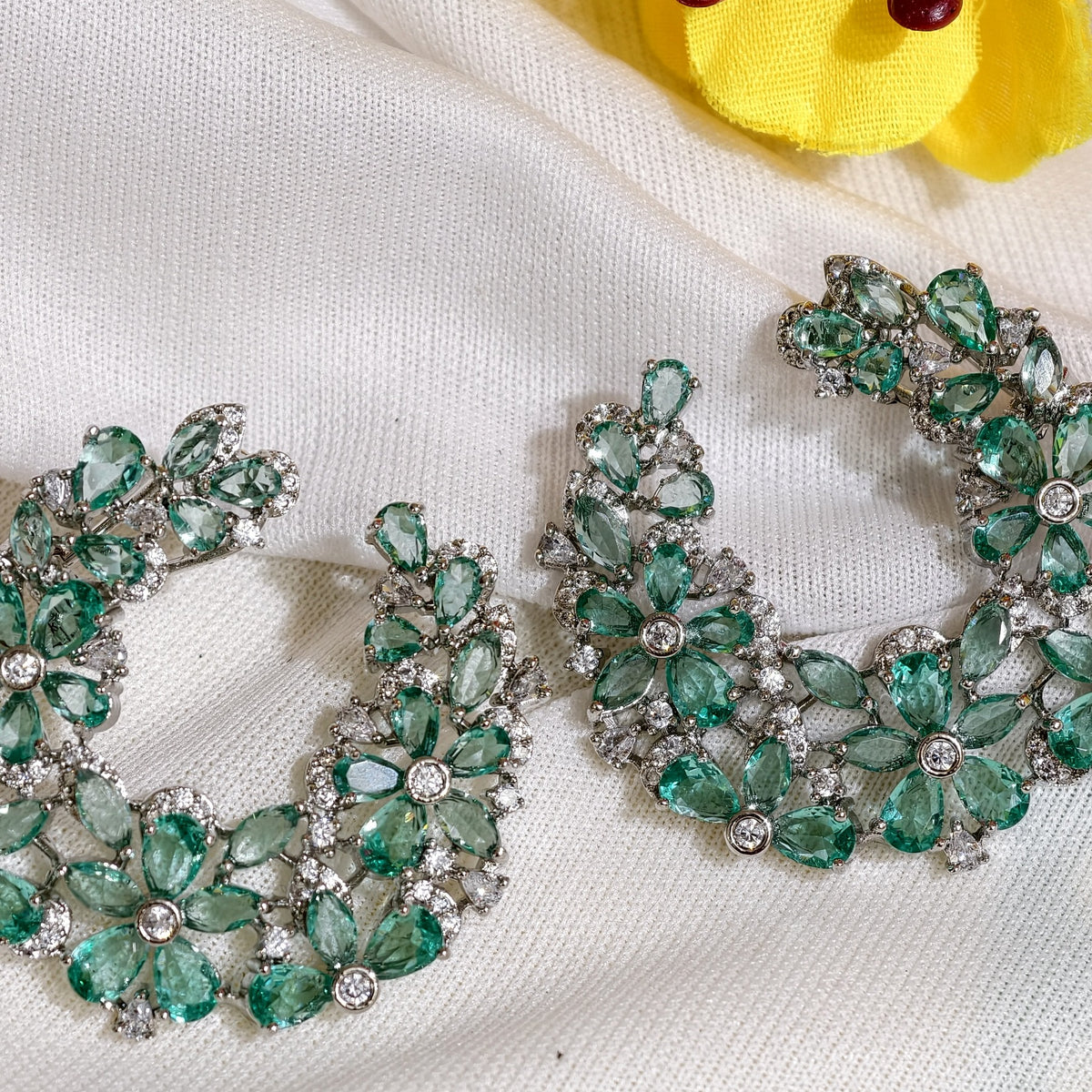 Close-up of Mint Green Nano Setting AD Floral Hoop Earrings