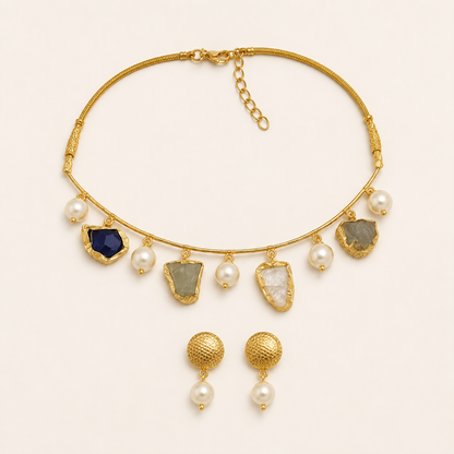 Gold-tone natural semi-precious stone necklace and matching earrings flat lay