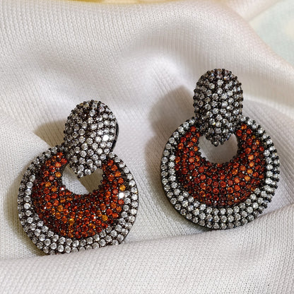 Close-up of Orange Nano Setting AD Circular Drop Earrings