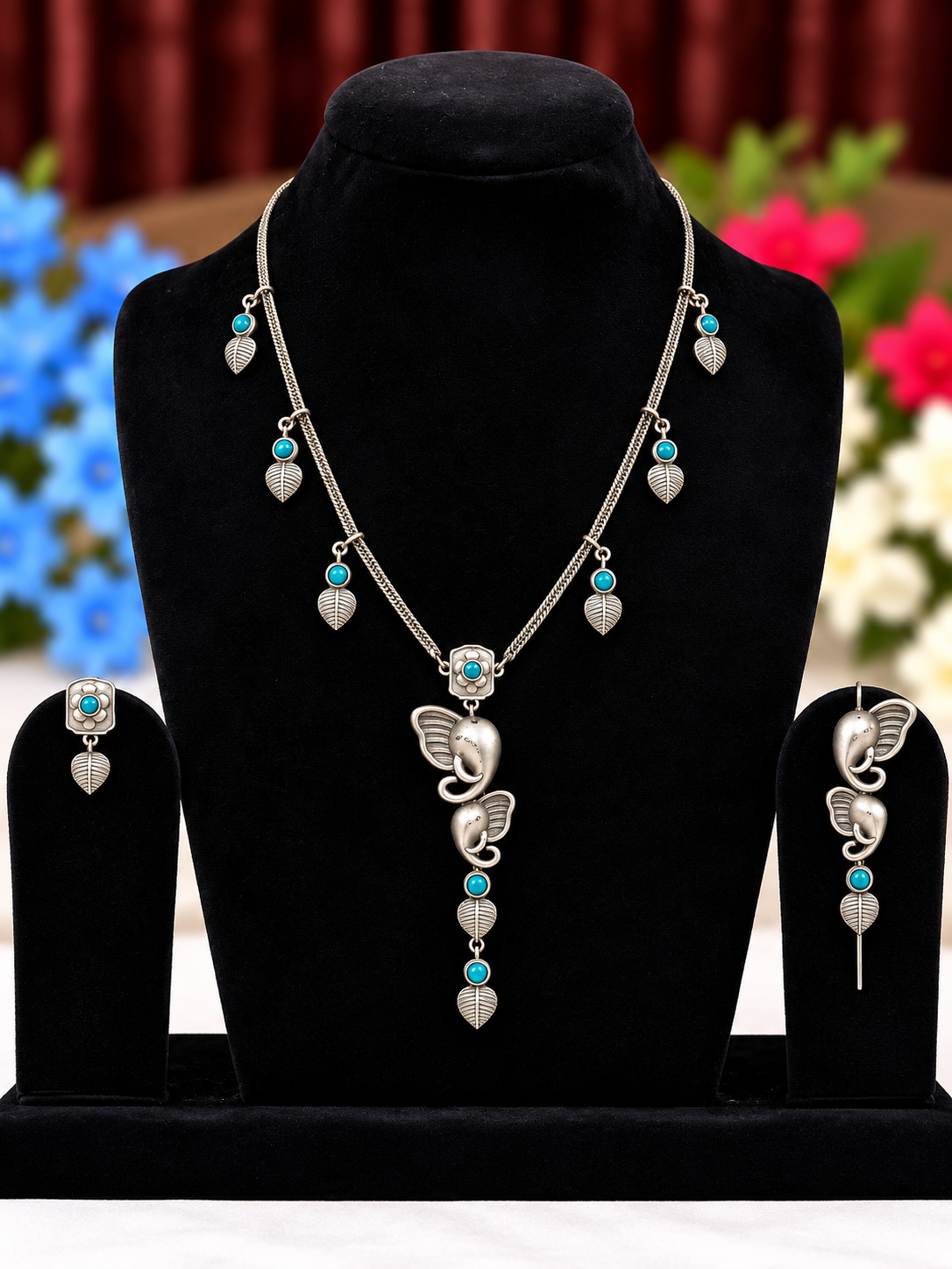 Oxidised silver replica butterfly necklace set with blue bead and pearl-style drops and matching earrings