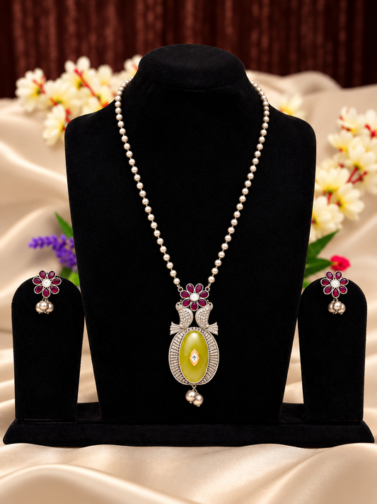 Oxidised silver replica green and pink stone pendant necklace set with pearl-style chain and matching earrings