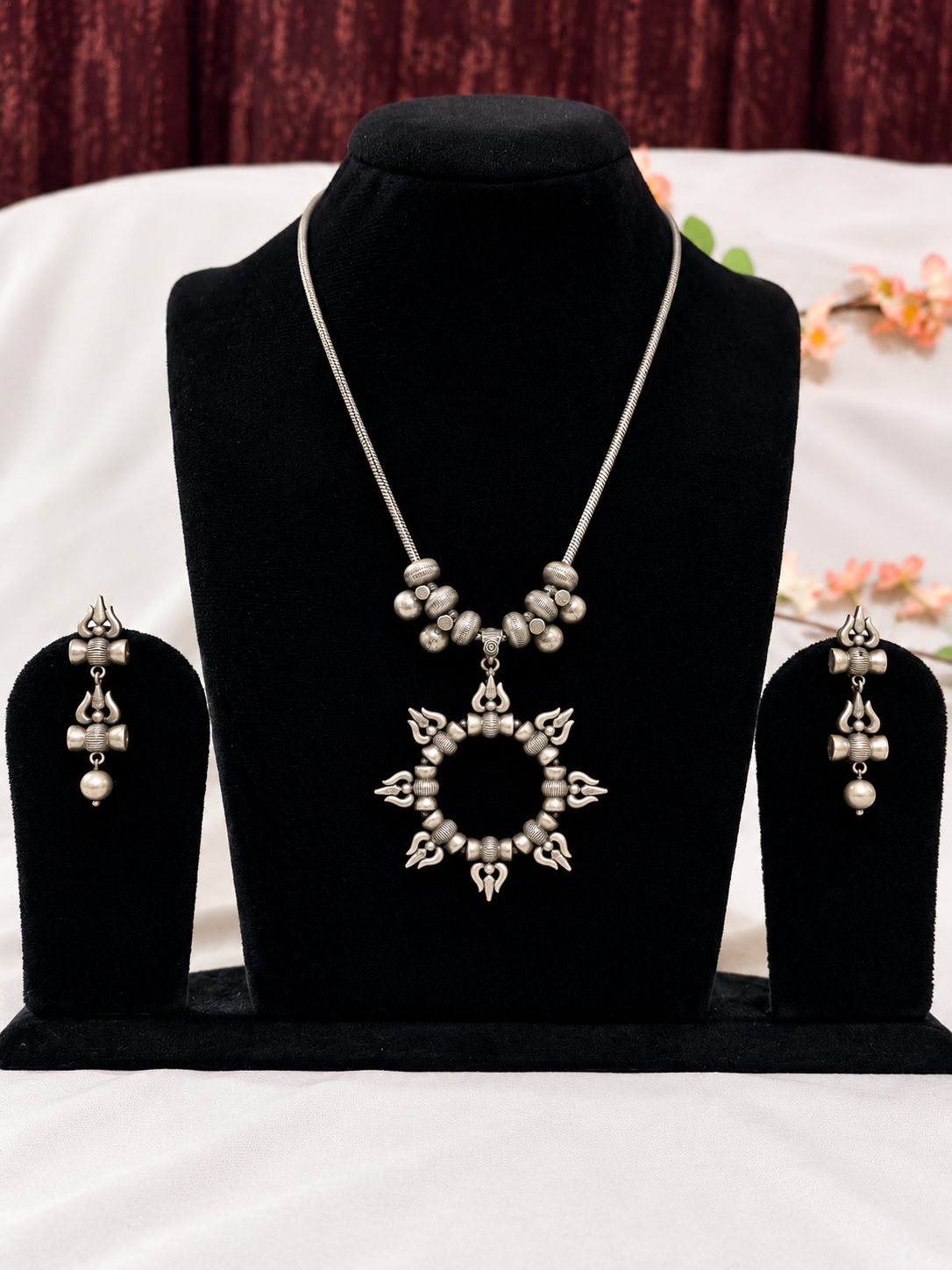 Oxidised silver replica trishul motif circular pendant necklace set with matching earrings