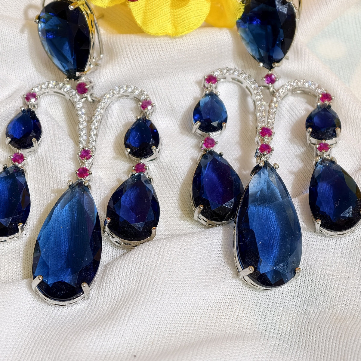 Close-up of Sapphire Blue Nano Setting AD Chandelier Earrings