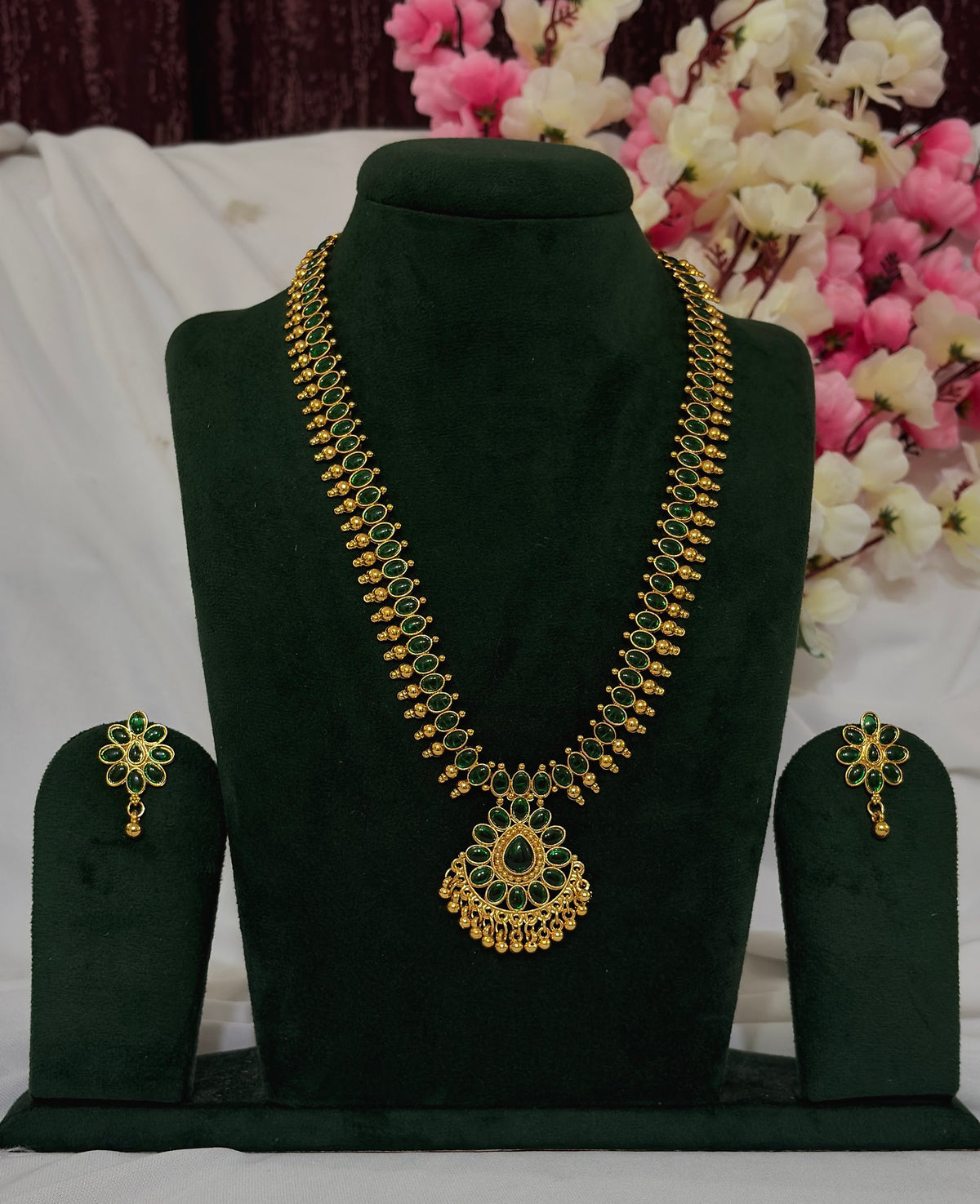 South Indian green stone long necklace set with matching floral earrings