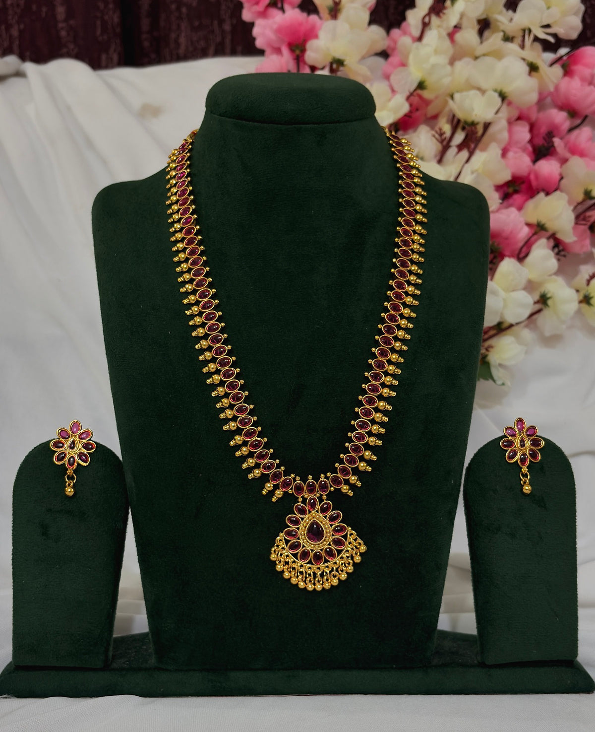 South Indian red stone long necklace set with matching floral earrings