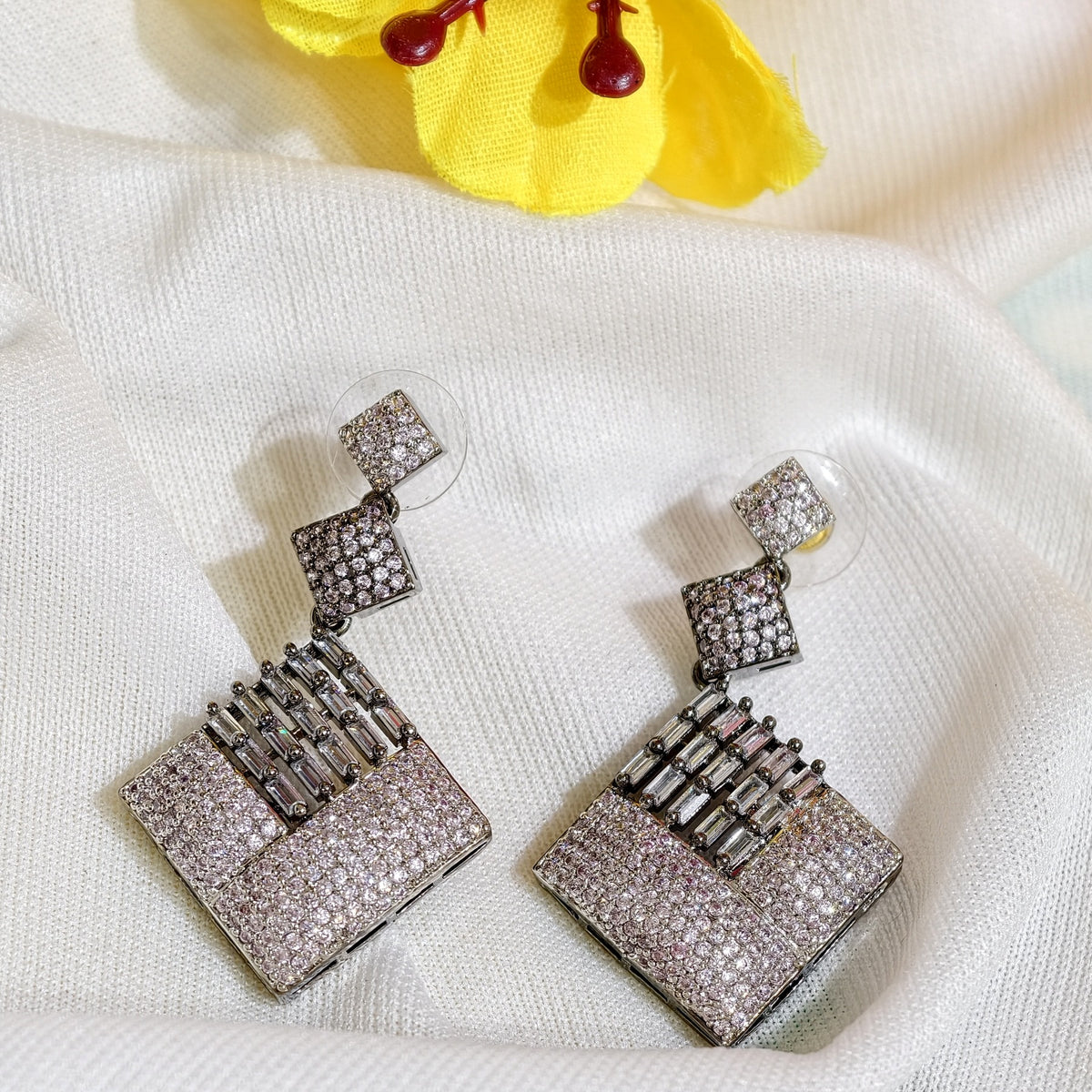 Close-up of White Nano Setting AD Geometric Drop Earrings